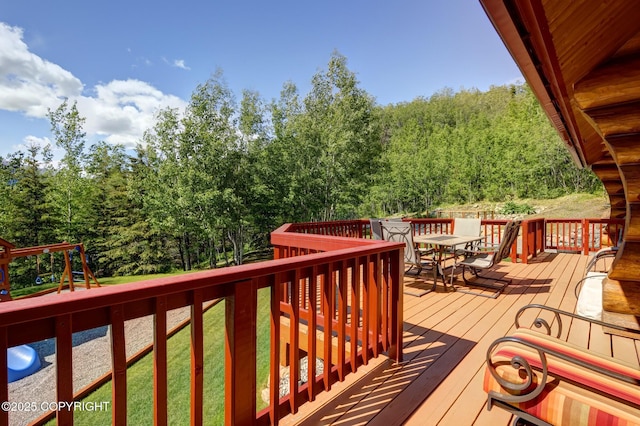 3108 Misty Mountain Rd, Eagle River, AK 99577 - wooden terrace with outdoor dining space, a playground, and a yard