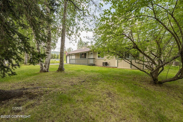 10010 Colville St, Eagle River, AK 99577 - view of grassy yard featuring a wooden deck