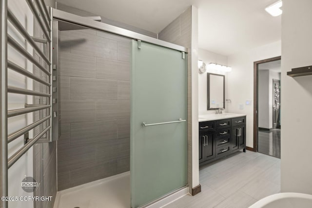10010 Colville St, Eagle River, AK 99577 - full bath with a stall shower, double vanity, and tile patterned floors