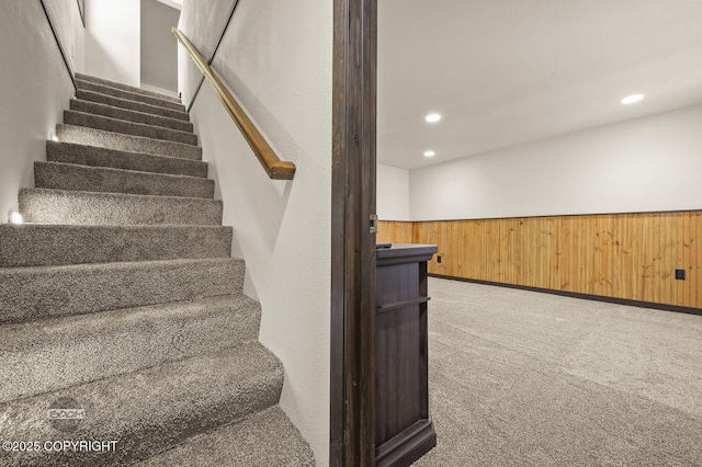 10010 Colville St, Eagle River, AK 99577 - stairs with carpet, wainscoting, recessed lighting, and wood walls