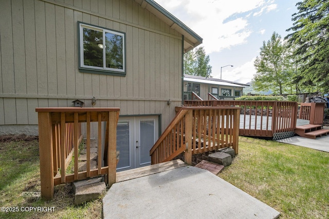 10010 Colville St, Eagle River, AK 99577 - back of house featuring a wooden deck and a yard