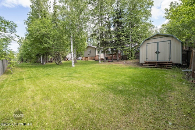 10010 Colville St, Eagle River, AK 99577 - view of yard with a storage shed and a deck