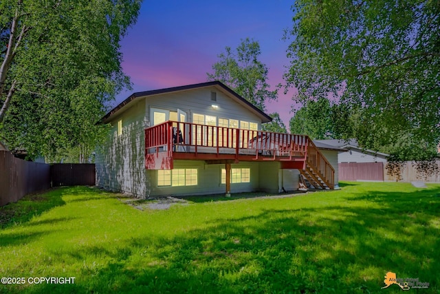2309 Success Dr, Anchorage, AK 99504 - back of property at dusk featuring a wooden deck, stairs, and a fenced backyard