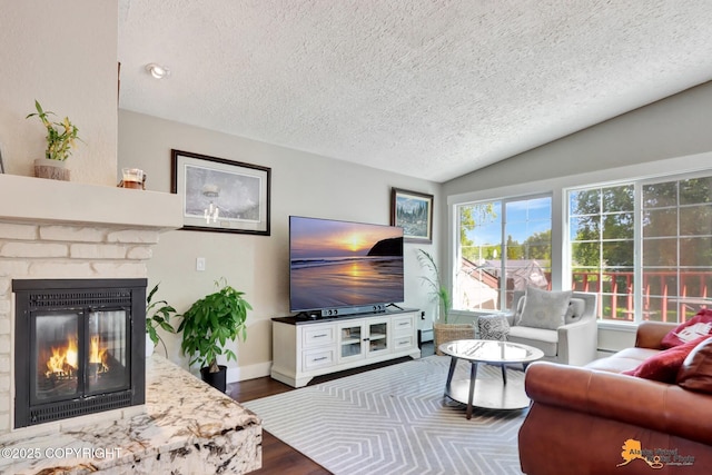 2309 Success Dr, Anchorage, AK 99504 - living room with a textured ceiling, a fireplace, lofted ceiling, and dark wood-style flooring
