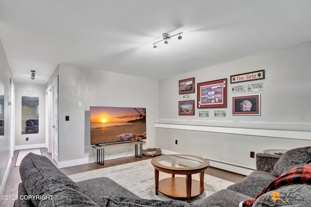 2309 Success Dr, Anchorage, AK 99504 - living room with wood finished floors and a baseboard heating unit