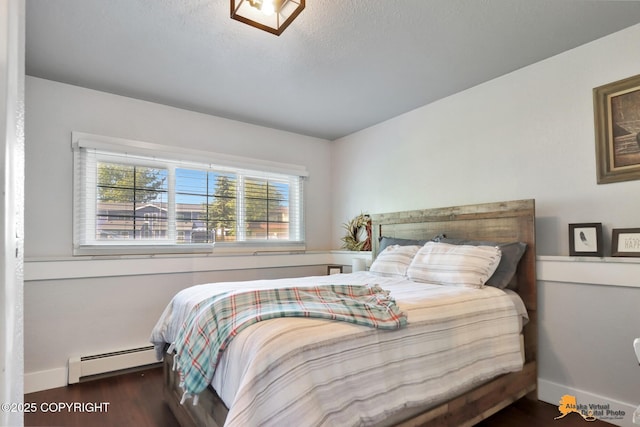 2309 Success Dr, Anchorage, AK 99504 - bedroom featuring a baseboard radiator and wood finished floors