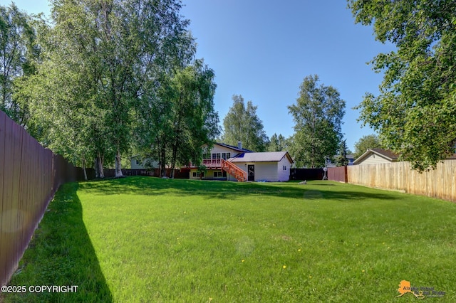 2309 Success Dr, Anchorage, AK 99504 - fenced backyard with stairs and a wooden deck