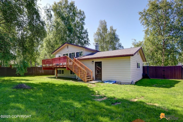 2309 Success Dr, Anchorage, AK 99504 - back of house with a deck, a fenced backyard, a chimney, and stairway