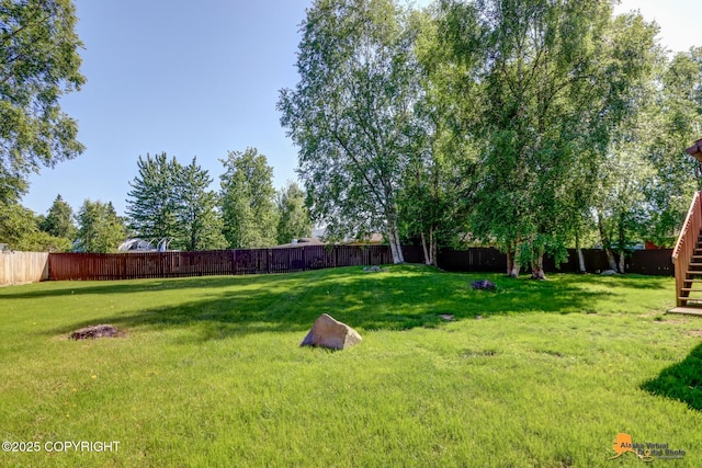2309 Success Dr, Anchorage, AK 99504 - fenced backyard with stairway