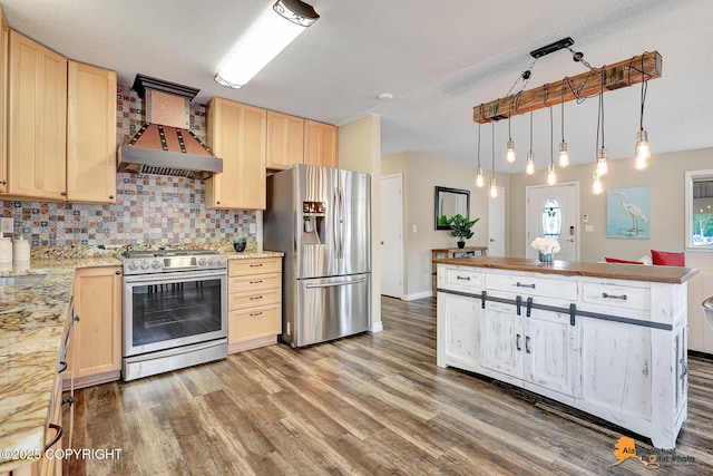 8630 E 17th Ave, Anchorage, AK 99504 - kitchen with appliances with stainless steel finishes, custom exhaust hood, light brown cabinetry, and tasteful backsplash