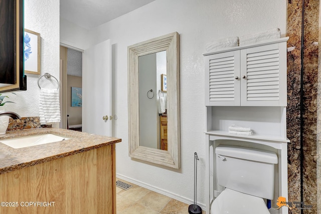 8630 E 17th Ave, Anchorage, AK 99504 - bathroom featuring vanity and toilet