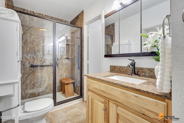 8630 E 17th Ave, Anchorage, AK 99504 - bathroom with vanity, a stall shower, and a textured ceiling