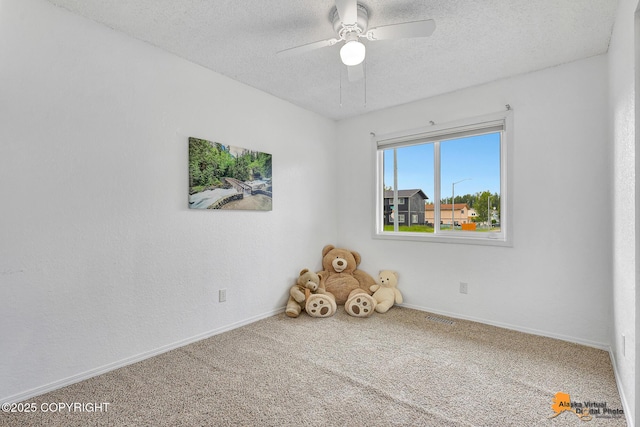 8630 E 17th Ave, Anchorage, AK 99504 - unfurnished room featuring a ceiling fan, carpet flooring, and a textured ceiling