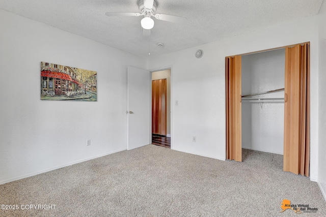 8630 E 17th Ave, Anchorage, AK 99504 - unfurnished bedroom featuring carpet floors, a closet, a textured ceiling, and ceiling fan