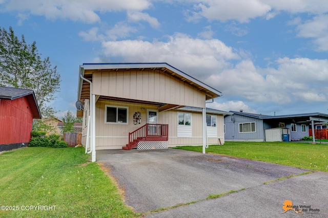 8630 E 17th Ave, Anchorage, AK 99504 - manufactured / mobile home with a front lawn and asphalt driveway