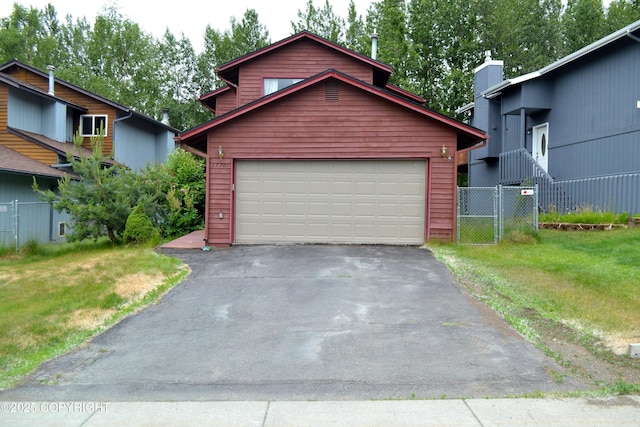 17701 Beaujolais Dr, Eagle River, AK 99577 - view of front of house with a garage and asphalt driveway