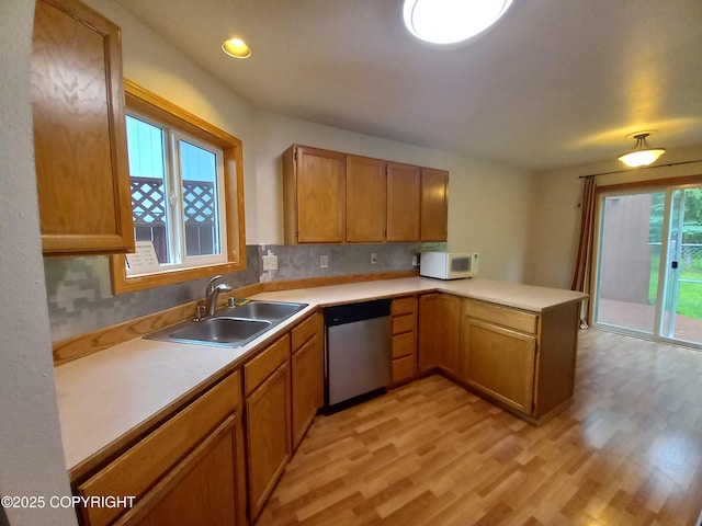 17701 Beaujolais Dr, Eagle River, AK 99577 - kitchen with dishwasher, a peninsula, white microwave, light countertops, and recessed lighting