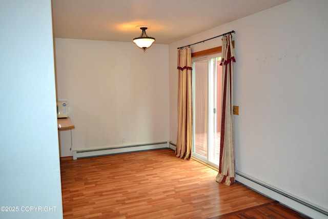 17701 Beaujolais Dr, Eagle River, AK 99577 - unfurnished room with baseboard heating and light wood-style flooring
