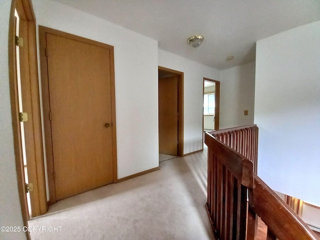 17701 Beaujolais Dr, Eagle River, AK 99577 - hallway with light colored carpet and an upstairs landing