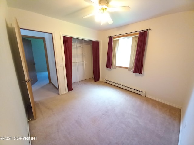17701 Beaujolais Dr, Eagle River, AK 99577 - unfurnished bedroom with baseboard heating, light colored carpet, a closet, and ceiling fan