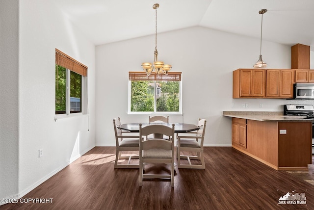 7595 E Breckenridge Dr, Wasilla, AK 99654 - dining space featuring lofted ceiling, a chandelier, and dark wood-type flooring