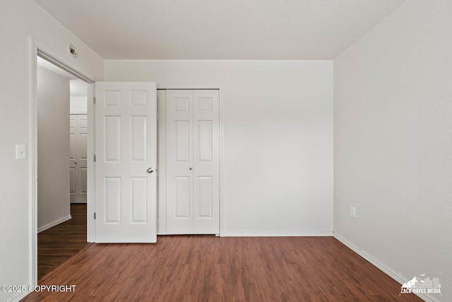 7595 E Breckenridge Dr, Wasilla, AK 99654 - unfurnished bedroom featuring wood finished floors and a closet
