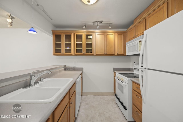 1675 Sitka St # 102, Anchorage, AK 99501 - kitchen with white appliances, brown cabinets, glass insert cabinets, decorative light fixtures, and light countertops