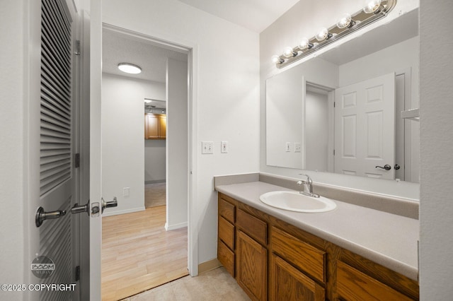 1675 Sitka St # 102, Anchorage, AK 99501 - bathroom with vanity and wood finished floors