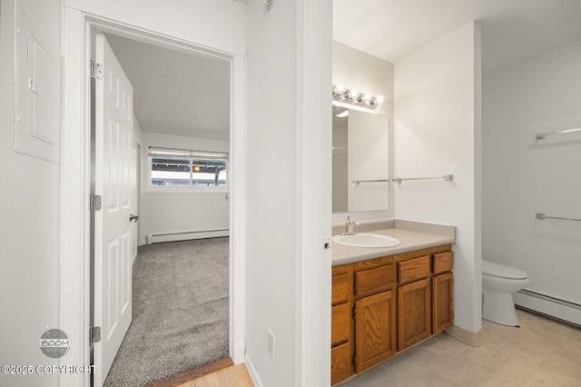 1675 Sitka St # 102, Anchorage, AK 99501 - bathroom featuring a baseboard radiator and vanity