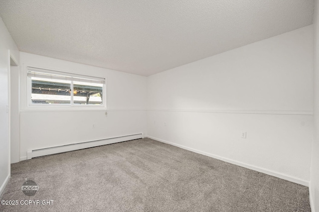 1675 Sitka St # 102, Anchorage, AK 99501 - carpeted empty room with a baseboard heating unit and a textured ceiling