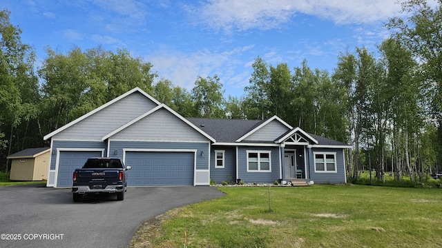 8028 E Yarn Spinner Cir, Palmer, AK 99645 - single story home featuring asphalt driveway, an attached garage, and a front yard