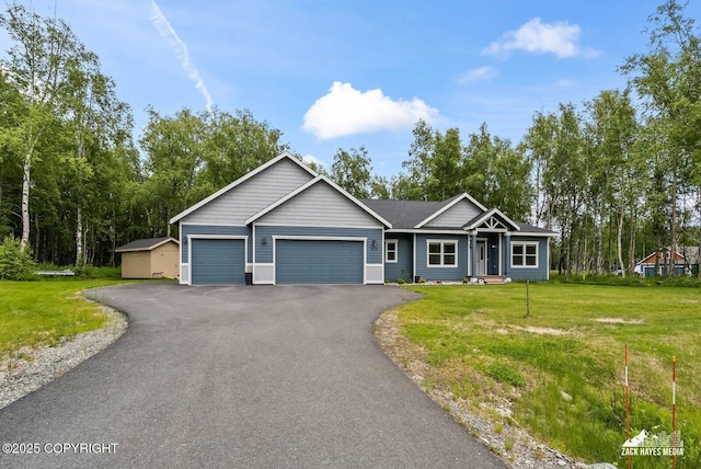 8028 E Yarn Spinner Cir, Palmer, AK 99645 - ranch-style house with an attached garage, a front yard, driveway, and a storage unit