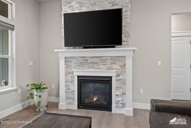 8028 E Yarn Spinner Cir, Palmer, AK 99645 - detailed view of wood finished floors and a stone fireplace