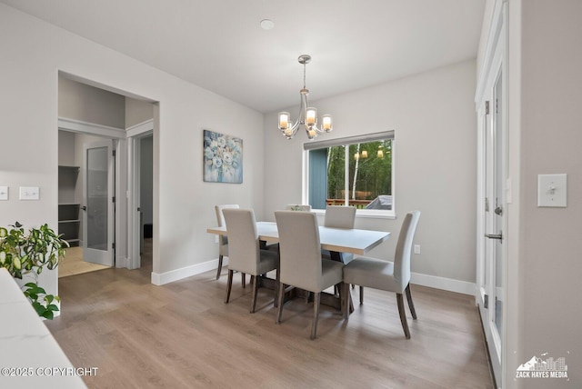 8028 E Yarn Spinner Cir, Palmer, AK 99645 - dining room with a chandelier and light wood finished floors