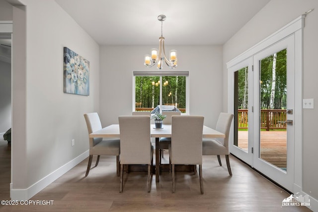 8028 E Yarn Spinner Cir, Palmer, AK 99645 - dining space with a chandelier and wood finished floors