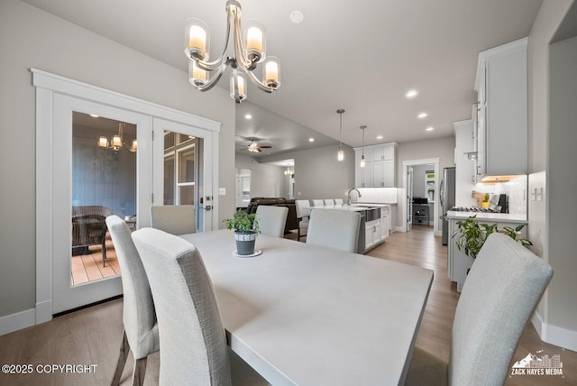 8028 E Yarn Spinner Cir, Palmer, AK 99645 - dining room featuring a chandelier, light wood-style flooring, recessed lighting, and a ceiling fan