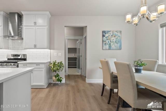8028 E Yarn Spinner Cir, Palmer, AK 99645 - dining area with light wood finished floors and a chandelier