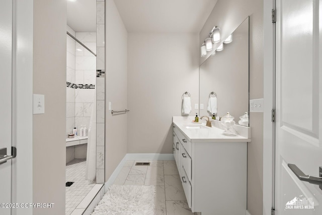 8028 E Yarn Spinner Cir, Palmer, AK 99645 - full bathroom featuring marble look tile flooring, double vanity, and a tile shower