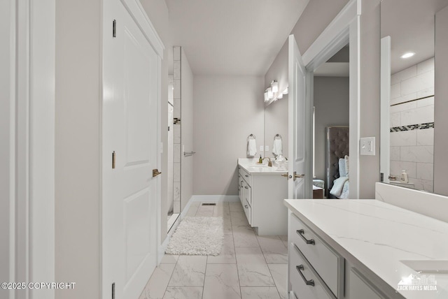8028 E Yarn Spinner Cir, Palmer, AK 99645 - ensuite bathroom featuring marble finish flooring, a shower stall, two vanities, and recessed lighting