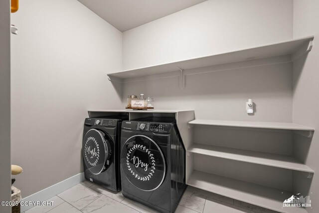 8028 E Yarn Spinner Cir, Palmer, AK 99645 - washroom featuring washing machine and clothes dryer and light marble finish floors