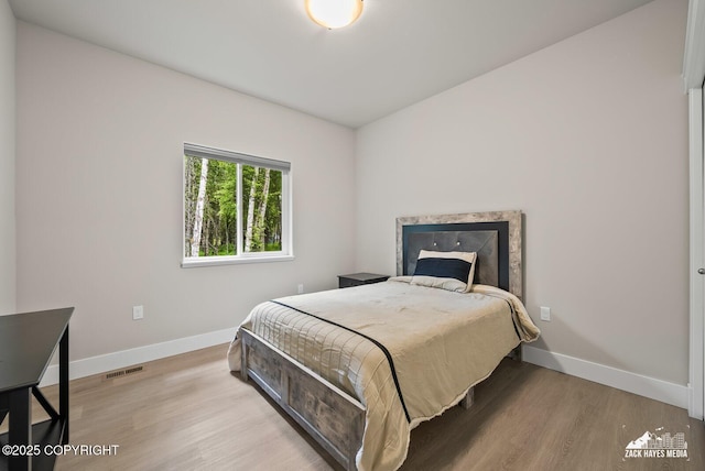 8028 E Yarn Spinner Cir, Palmer, AK 99645 - bedroom with baseboards and wood finished floors