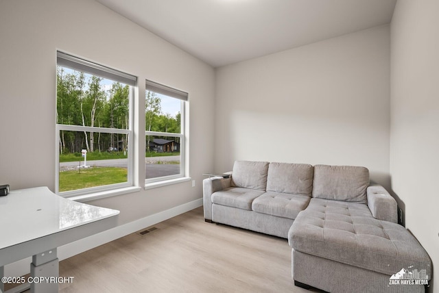 8028 E Yarn Spinner Cir, Palmer, AK 99645 - living room with light wood-style floors and baseboards