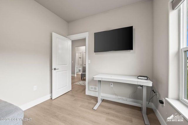 8028 E Yarn Spinner Cir, Palmer, AK 99645 - home office featuring light wood-style flooring and plenty of natural light