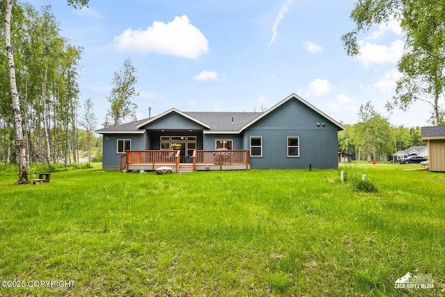 8028 E Yarn Spinner Cir, Palmer, AK 99645 - rear view of property with a wooden deck and a yard