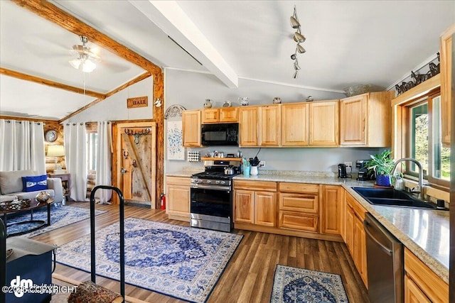 71252 Siri, Anchor Point, AK 99556 - kitchen with appliances with stainless steel finishes, a ceiling fan, light countertops, open floor plan, and dark wood-style floors