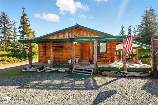 71252 Siri, Anchor Point, AK 99556 - log-style house featuring a porch and log siding