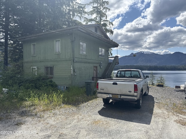 406 Mitkof Hwy, Petersburg, AK 99833 - view of side of home featuring stairway and a water and mountain view