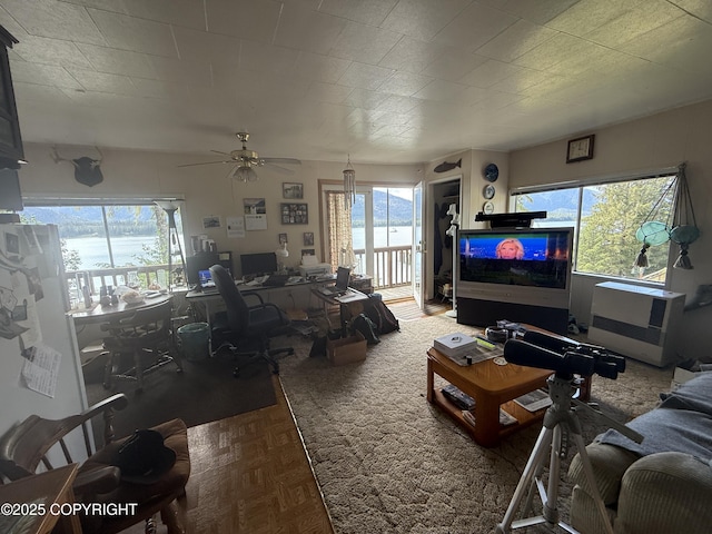 406 Mitkof Hwy, Petersburg, AK 99833 - living room with an office area, healthy amount of natural light, and ceiling fan