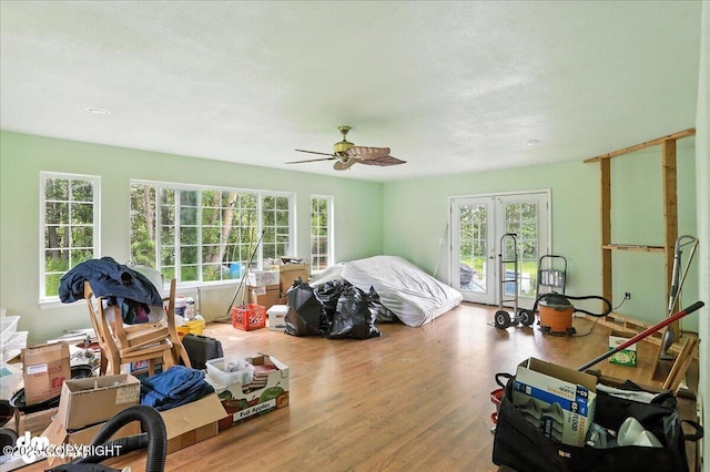 701 N Luke St, Wasilla, AK 99654 - bedroom featuring french doors, access to outside, wood finished floors, a ceiling fan, and a textured ceiling