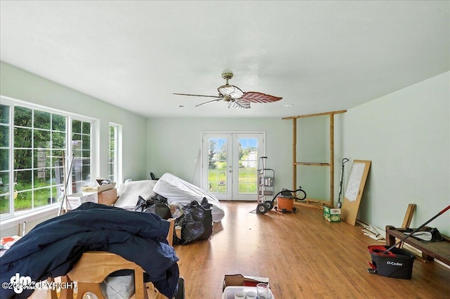 701 N Luke St, Wasilla, AK 99654 - unfurnished bedroom with access to outside, french doors, wood finished floors, and a ceiling fan